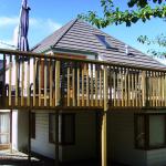 new decking, roof, and cedar bi-fold doors.